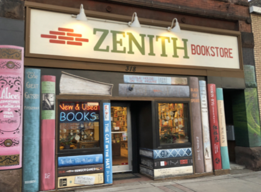 Storefront of Zenith Bookstore, painted with book images
